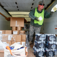 Michigan National Guard Staff Sgt. James Green hands out a water test kit to be distributed to residents Jan. 21, 2016, in Flint, Mich.